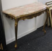 A gilt decorated marble topped console table, with associated marble. The base 101 cm wide.