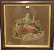 A Victorian woolwork picture depicting a Woman and Dog, framed and glazed. 64 x 60 cm overall.