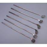 A set of six golf club form cocktail sticks. 21 cm high.