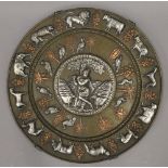 A Hindu unmarked silver, copper and bronze charger. 40 cm diameter.