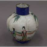 An 18th century Chinese enamel vase. 15.5 cm high.