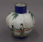 An 18th century Chinese enamel vase. 15.5 cm high.