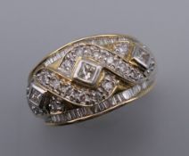 A 14K gold ring set with multiple diamonds of various cuts. Ring size N/O. 6.