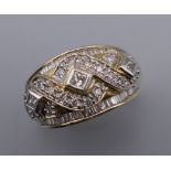 A 14K gold ring set with multiple diamonds of various cuts. Ring size N/O. 6.