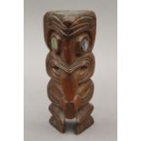 A Maori carved wooden Tiki figure. 18 cm high.