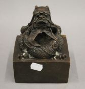 A bronze dragon seal. 15 cm high.