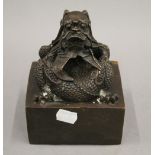 A bronze dragon seal. 15 cm high.