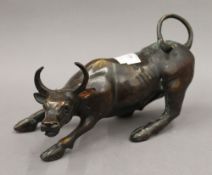 A bronze model of a bull. 28 cm long.