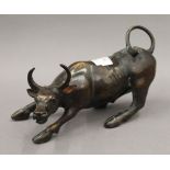 A bronze model of a bull. 28 cm long.