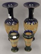 Two pairs of Royal Doulton stoneware vases. The largest 35 cm high.