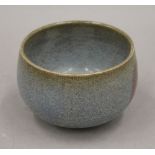 A Chinese red spot glazed bowl. 13 cm diameter.