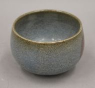 A Chinese red spot glazed bowl. 13 cm diameter.