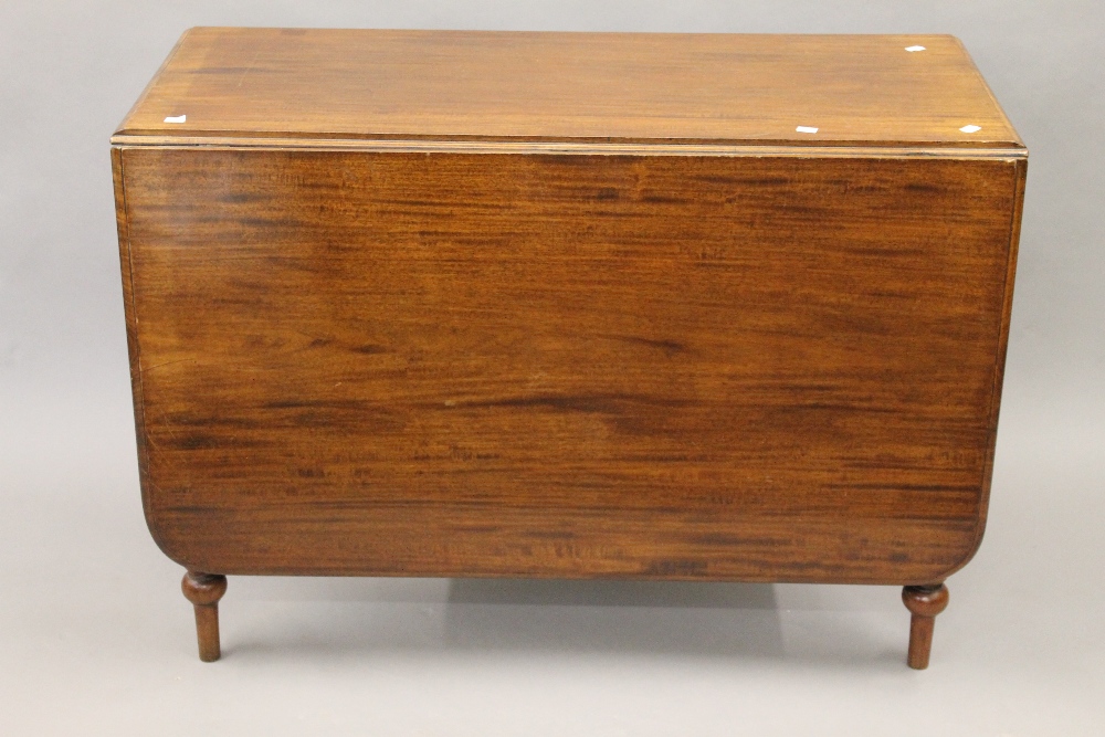 A Victorian mahogany drop leaf table. 106 cm wide.