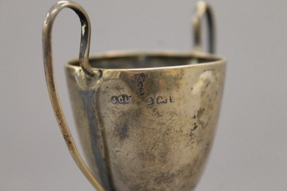 A silver bud vase, a small silver trophy cup and a broken silver trophy cup. The former 22 cm high. - Image 9 of 12