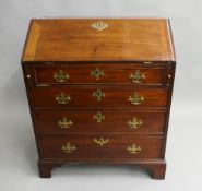 A Georgian mahogany bureau. 76 cm wide.