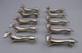 A set of ten Dachshund formed knife rests.