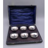 A set of six silver napkin rings with fine overall engraving, Birmingham 1921, in presentation box.