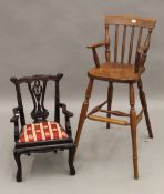 A modern oak child's highchair and a dolls chair. The former 81.5 cm high.