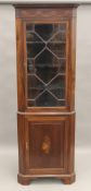 An Edwardian inlaid mahogany corner cabinet. 201 cm high.