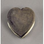 A silver heart shaped trinket box. 8.5 cm wide. 2.7 troy ounces total weight.