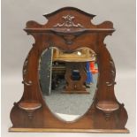 A Victorian mahogany overmantle. 101 cm wide.