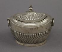 A silver tea caddy. 11 cm wide. 4 troy ounces.