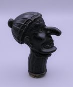 A Victorian pipe tamper formed as Mr Punch. 6.5 cm high.