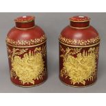 A pair of toleware tea tins. 37 cm high.