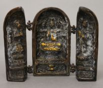 A bronze triptych. 13.5 cm high.