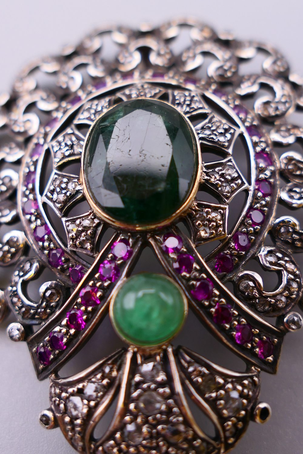 A vintage silver and gold mounted emerald, diamond and ruby pendant. 7.5 cm high. 21. - Image 2 of 5