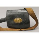 A 19th century United States Army leather bag, with fitted interior and brass badges. 23.5 cm wide.