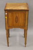 A Victorian inlaid pot cupboard. 41 cm wide.