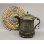 A large Tibetan brass teapot and an Indian brass charger. The former 31 cm high.