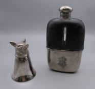 A silver plated hip flask and a silver plated fox mask stirrup cup. The latter 8 cm high.