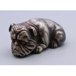 A silver model of a dog, bearing Russian marks. 6.5 cm long.
