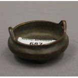 A Chinese miniature bronze censer. 5.5 cm diameter.