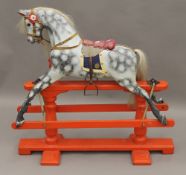 An early 20th century rocking horse. 90 cm long, 87 cm high.