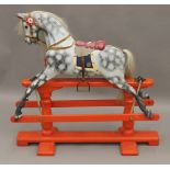 An early 20th century rocking horse. 90 cm long, 87 cm high.