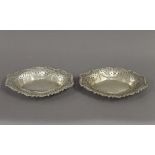 A pair of pierced silver bon bon dishes. Each 21 cm wide. 6.1 troy ounces.