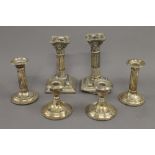 Three small pairs of silver candlesticks. The largest 15.5 cm high. 46.7 troy ounces weighted.