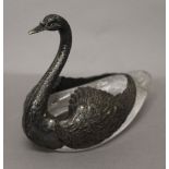 A silver and crystal glass swan. 21 cm long.