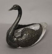 A silver and crystal glass swan. 21 cm long.