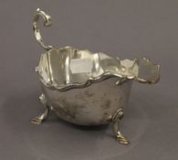 A silver sauce boat. 16.5 cm long. 6.6 troy ounces.