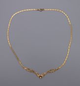 A 9 ct gold snake herringbone necklace. 40 cm long. 3 grammes.