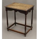 A Victorian carved oak side table. 59.5 cm wide.