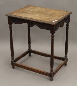 A Victorian carved oak side table. 59.5 cm wide.