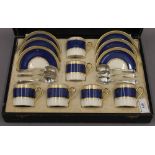 A cased set of six Crown Devon Fielding 2354 coffee cans, saucers, with silver teaspoons,