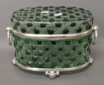 A green cut glass casket. 20 cm high.