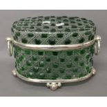 A green cut glass casket. 20 cm high.