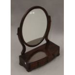 A 19th century mahogany two drawer toilet mirror. 49 cm wide.